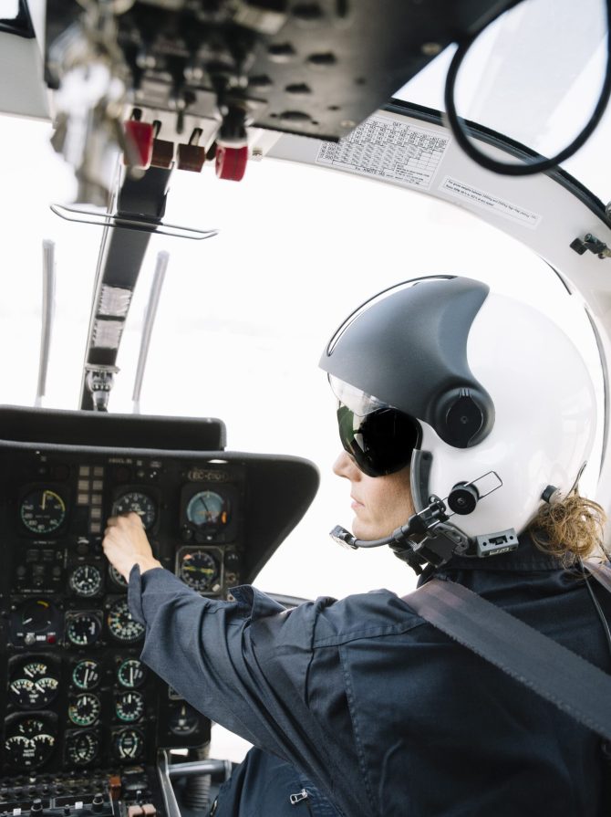 attractive-woman-pilot-sitting-in-the-helicopter-2022-03-04-05-45-16-utc (1) (1)